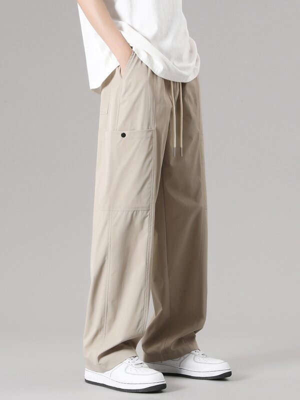 Wiosenne letnie męskie spodnie dresowe koreańskie modne ściągany sznurkiem w pasie casualowe spodnie dresowe męskie luźne proste drapowane spodnie