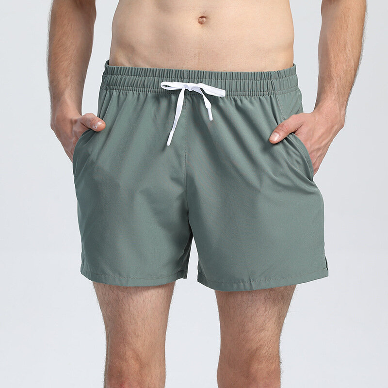 Nuovi pantaloncini da Yoga elasticizzati pantaloncini da corsa sportivi ad asciugatura rapida pantaloni traspiranti sottili estivi da uomo con una varietà di colori con