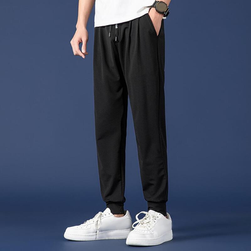 Pantalones deportivos de malla transpirable con costuras de bolsillo reforzadas para hombre, bolsillos de cintura con cordón elástico, ligeros para ropa de calle