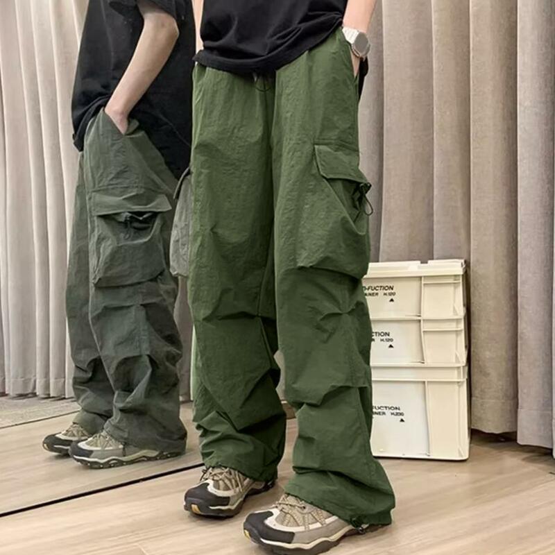Celana panjang kerja pria, celana kargo lelaki dengan beberapa saku longgar pinggang elastis modis Streetwear untuk pinggul