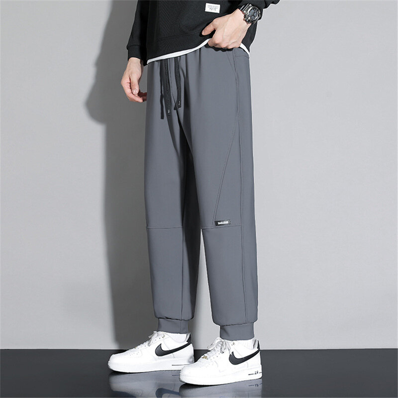 Wodoodporne spodnie dresowe męskie spodnie do joggingu Plus Size10XL moda na co dzień spodnie rozciągliwe męskie duże spodnie z elastyczną talią