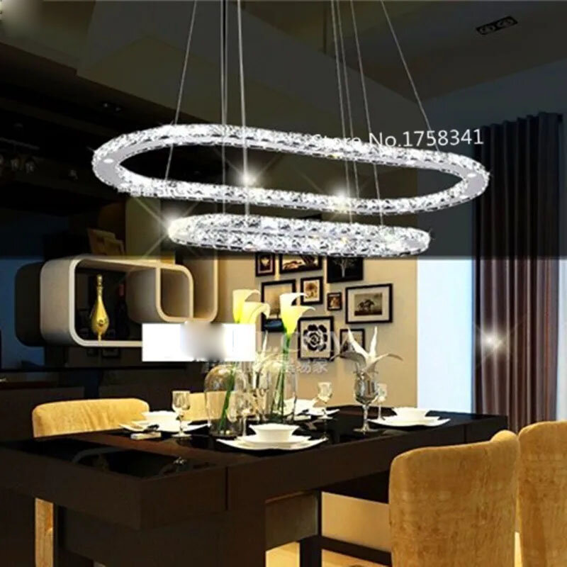 โคมไฟแขวน LED สำหรับห้องนั่งเล่นความคิดสร้างสรรค์สมัยใหม่เป็นรูปสี่เหลี่ยมผืนผ้าทำจากสแตนเลส lampu gantung Kristal เบา