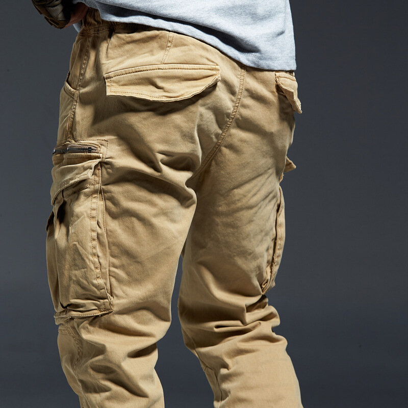 Długie spodnie do biegania Cargo męskie jeansowe bawełniane duże kieszenie elastyczne w talii długie spodnie męskie zimowe grube spodnie taktyczne