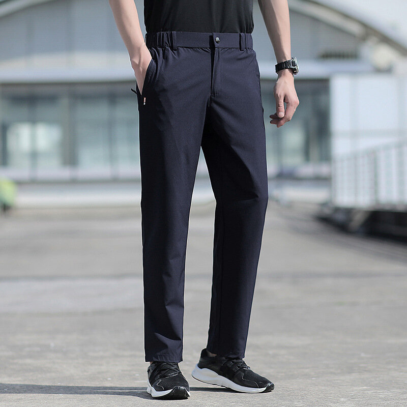 Duży rozmiar męski spodnie na lato duży rozmiar lodowy jedwab rozciągliwy oddychający proste nogawki 6XL szybkoschnący elastyczny pasek czarne spodnie