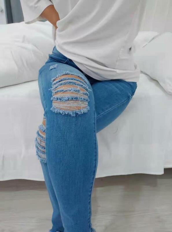 Jeans wanita 2024, celana panjang Denim sobek ramping, desain saku berkancing, tren jalanan