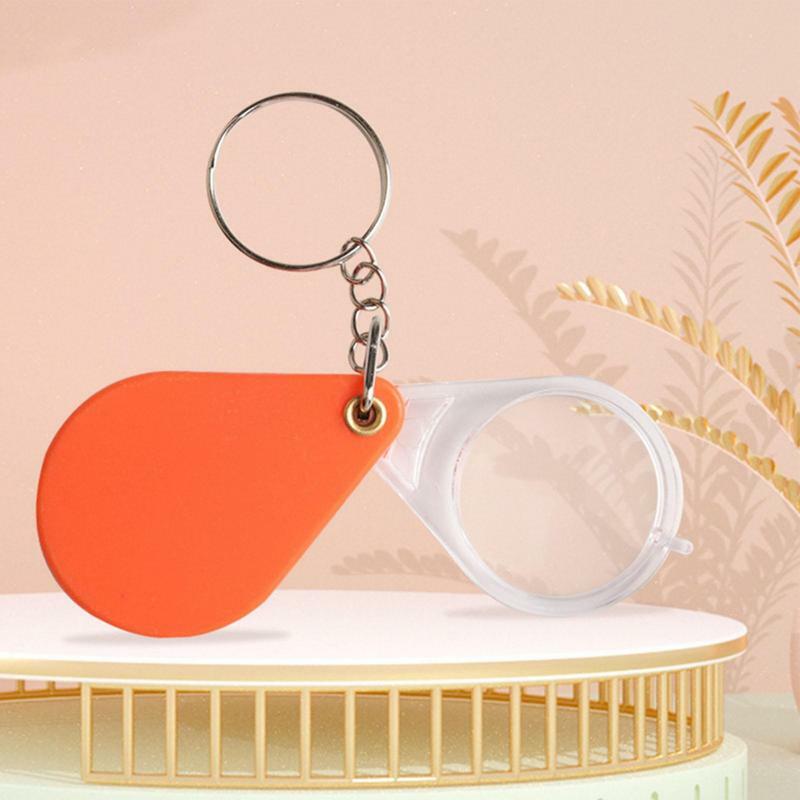 แว่นขยายพวงกุญแจมือถือขนาดเล็กพวงกุญแจแบบพับแว่นขยายสีส้มแบบพกพาสำหรับบ้านคนชรา