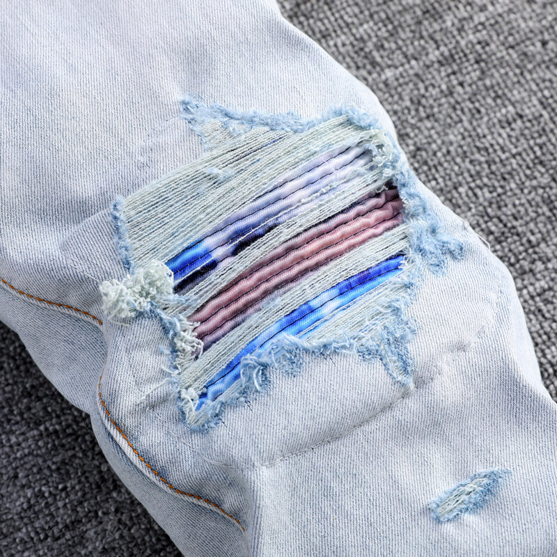 Modne dżinsy męskie uliczna wysokiej jakości światło Retro niebieski elastyczny chudy krój porwane jeansy mężczyzn łatany projektant Hip Hop markowe spodnie