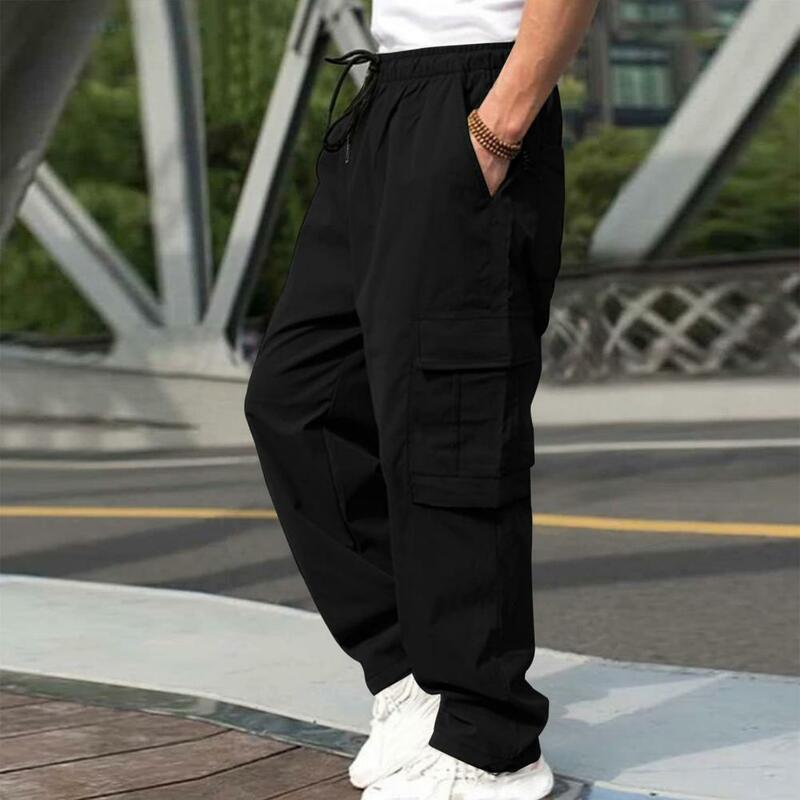Calça de perna larga masculina com cintura com cordão, bolsos múltiplos, calça solta, estilo casual de streetwear