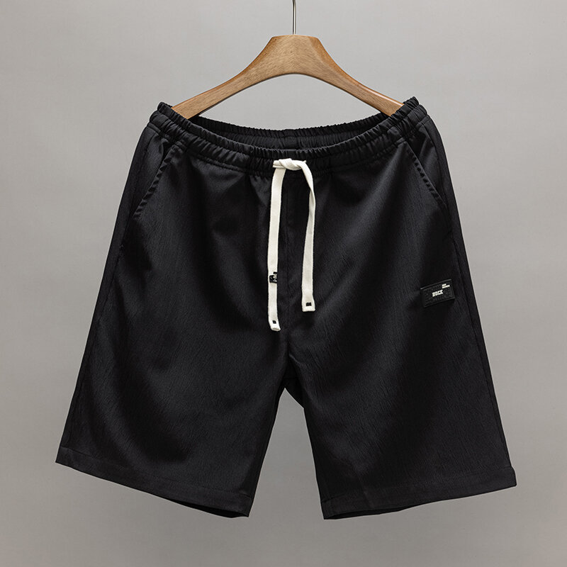 Celana pendek dasar pria, bawahan olahraga hitam abu-abu longgar bernafas ringan musim panas klasik