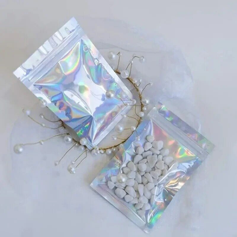 Zamykające się laserowe samoczynnie torby na zamek opakowania dla małych firm holograficzne koperty płaskie przezroczysty z tworzywa sztucznego torba do przechowywania żywności do biżuterii z cukierkami