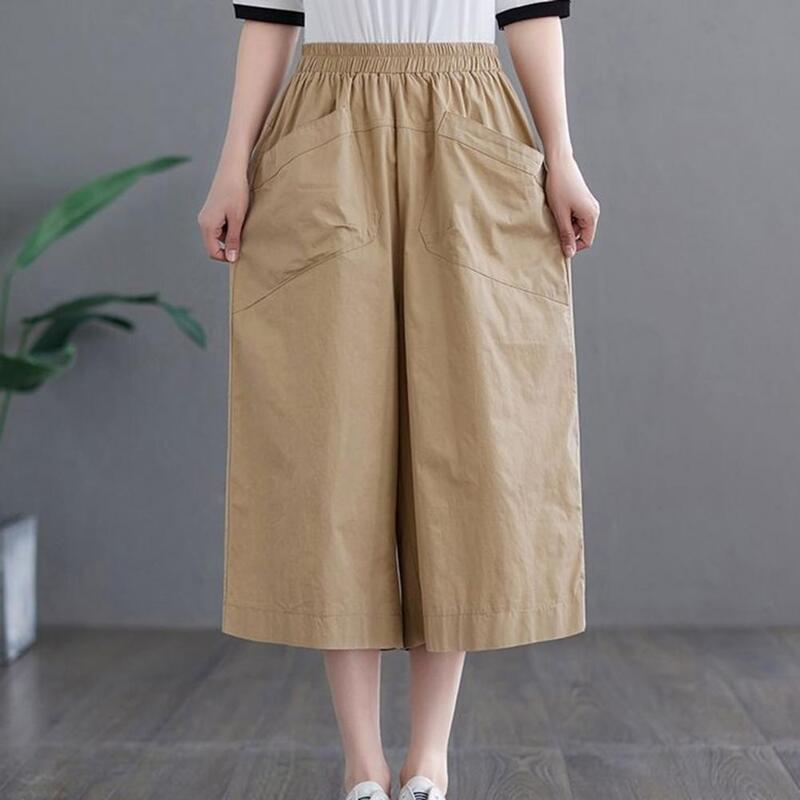 Брюки женские укороченные с карманами, стильные однотонные свободные штаны до середины икры с широкими штанинами, с эластичным поясом, на лето