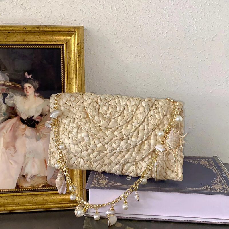 Borsa di paglia di perle di conchiglia bohémien catene di conchiglie borse borsa a tracolla in Rattan intrecciata a mano borse da spiaggia da viaggio di lusso per donna 2024