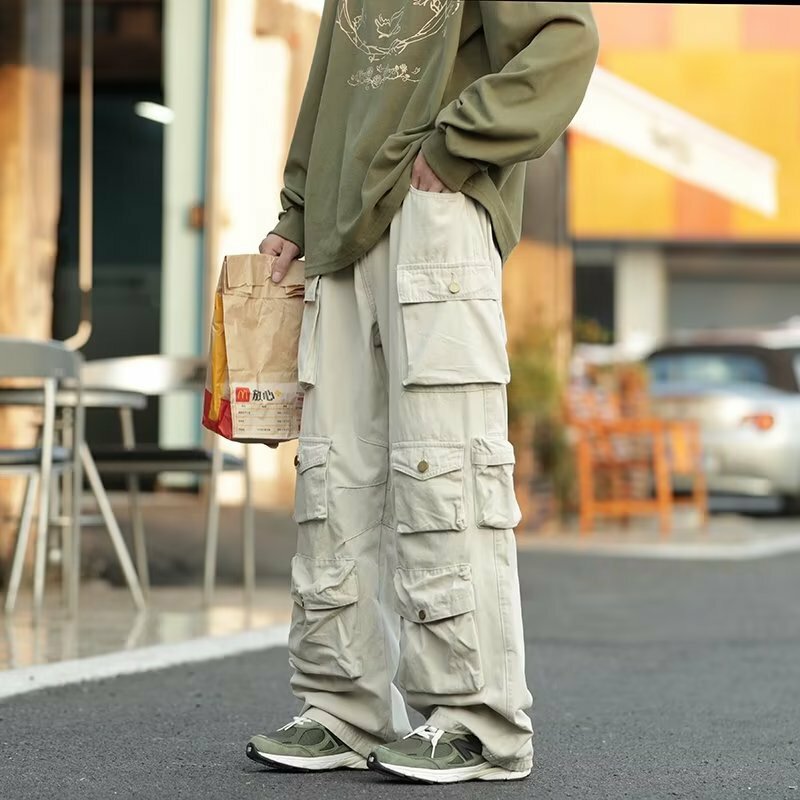 Tuta Multi-tasca popolare da strada pantaloni Casual larghi stile Harajuku da uomo pantaloni Hip Hop da donna retrò High Street