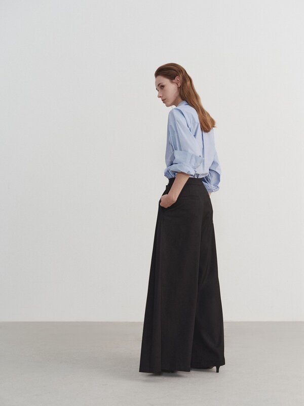 Duża sylwetka plisowana styl projektowania szare spodnie z szerokimi nogawkami na wiosenne luźne spodnie do podłogi dla kobiet z wysokim stanem