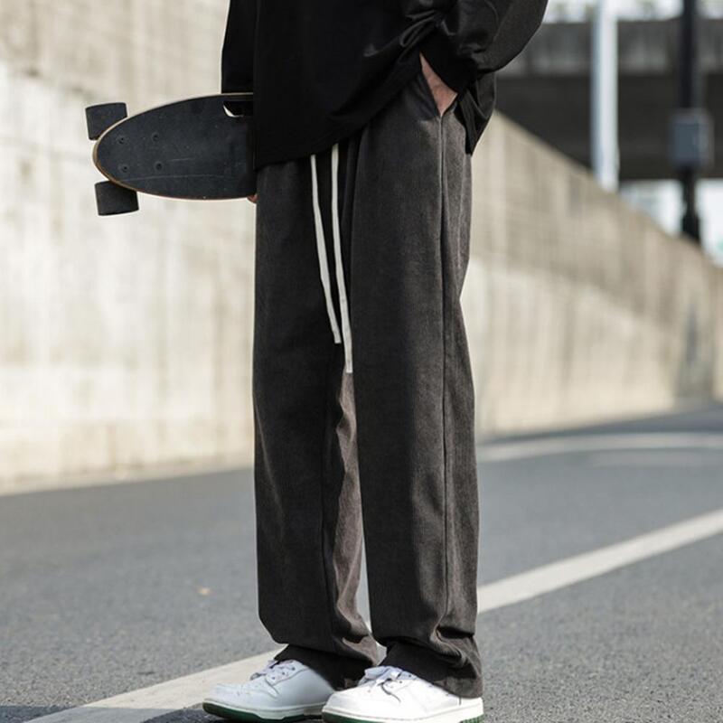 กางเกงระบายอากาศสำหรับผู้ชายกางเกงสเวตเตอร์มีสไตล์สวมใส่สบายเอวขากว้างมีกระเป๋าลึกยืดหยุ่นสำหรับ Comfort สีพื้น