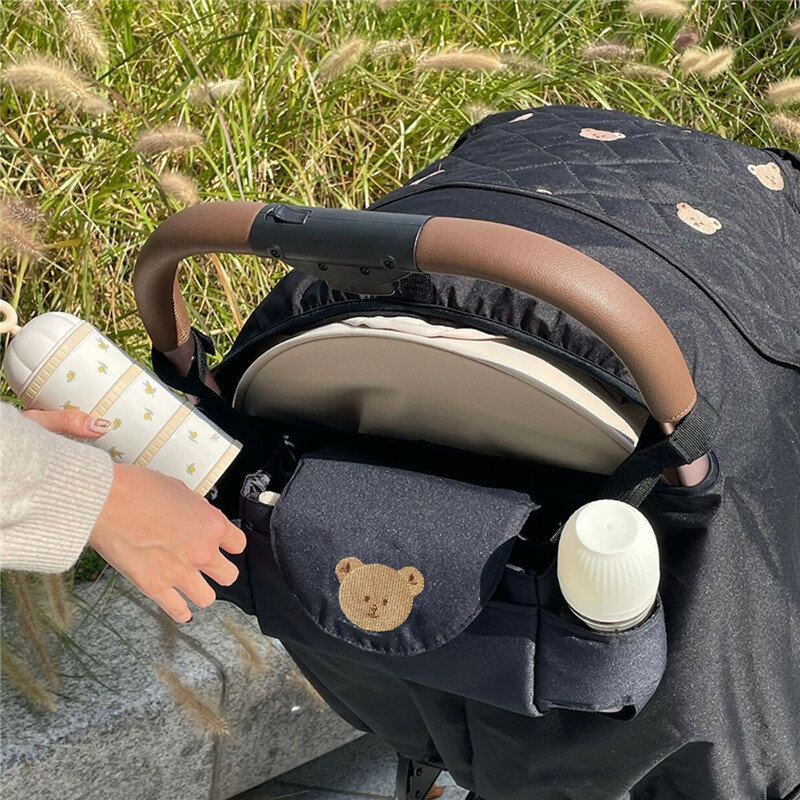 กระเป๋าแขวนรถเข็นเด็กทารกแบบพกพาถุงเก็บของแขวนรถเข็นเด็กกระเป๋าคุณแม่ปักลายการ์ตูนหมี