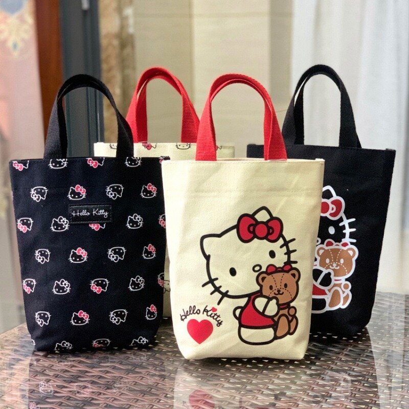 ใหม่ล่าสุดกระเป๋าถือผ้าใบลายน่ารัก Sanrio Hello Kitty กระเป๋าใส่ถ้วยน้ำกระเป๋าใส่ข้าวกลางวันน่ารัก Kuromi Cinnamoroll storagebag แบบพกพา