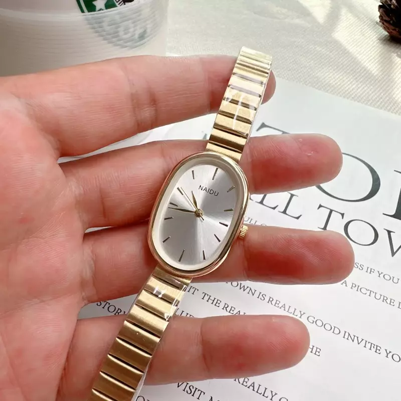 Женские часы с овальным циферблатом, Роскошные Кварцевые часы с ремешком из сплава для женщин, универсальные маленькие наручные часы со складной застежкой, 2023