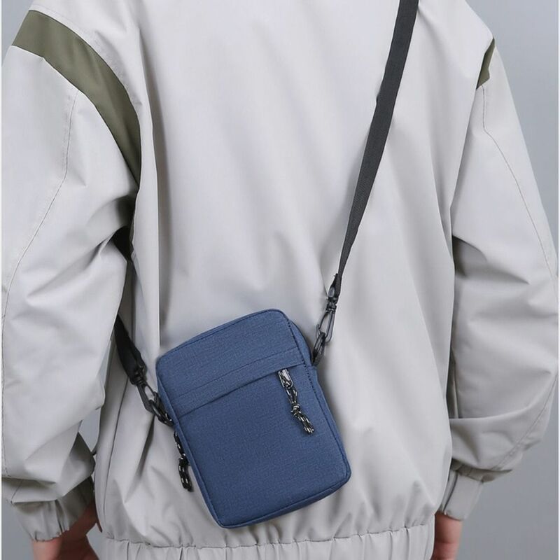 Na co dzień męska torba nowa koreańska jednokolorowa sportowa torba na ramię studencka torba na telefon nylonowa mała torebka