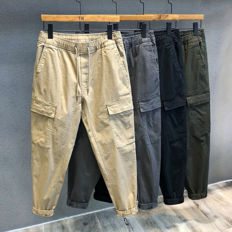 Spodnie z czystej bawełny Wiosna Wiązane stopy Spodnie robocze Mężczyźni Dorywczo Kieszeń Jednolity kolor Luźne koreańskie kieszenie Elastyczne spodnie w talii