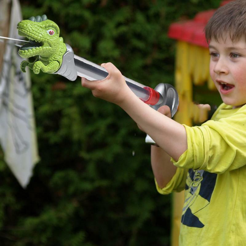 Giocattoli a spruzzo d'acqua di dinosauro giocattoli da combattimento all'aperto a forma di dinosauro di dinosauro del fumetto dei bambini per il parco del giardino