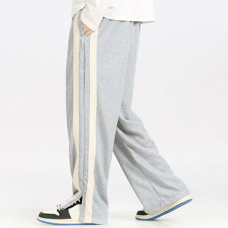 Spodnie z elastyczną gumką w pasie w paski szerokie nogawki męskie spodnie dresowe ze sznurkiem elastyczne w talii głębokie krocze na cztery sezony sportowe