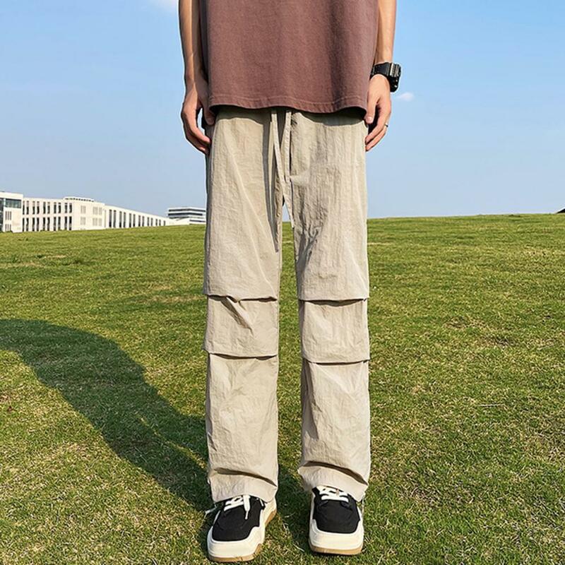 Celana panjang pinggang elastis pria, bawahan ukuran besar kaki lebar dengan ritsleting kantong samping untuk latihan Gym Jogging pinggang elastis