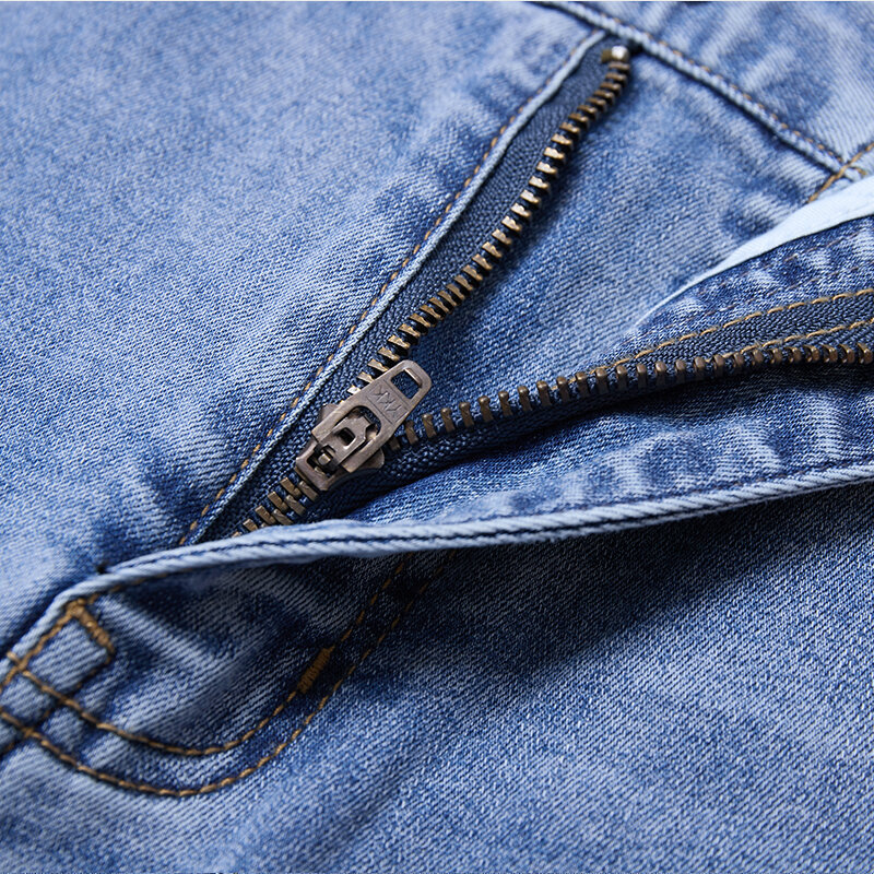 กางเกงยีนส์ลำลองธุรกิจขนาดใหญ่สำหรับผู้ชายกางเกงยีนส์กางเกงผู้ชายขาสามส่วนยืดทรงหลวมแฟชั่นสีฟ้า