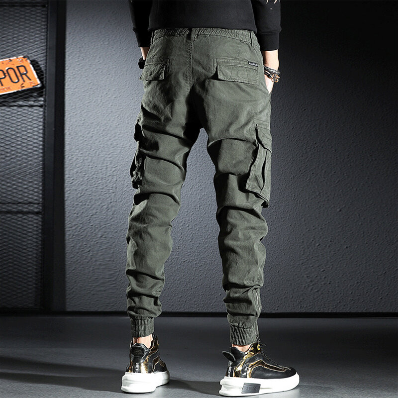 Streetwear moda masculina jeans solto ajuste multi bolsos casuais calças de carga hombre zíper designer hip hop corredores macacão