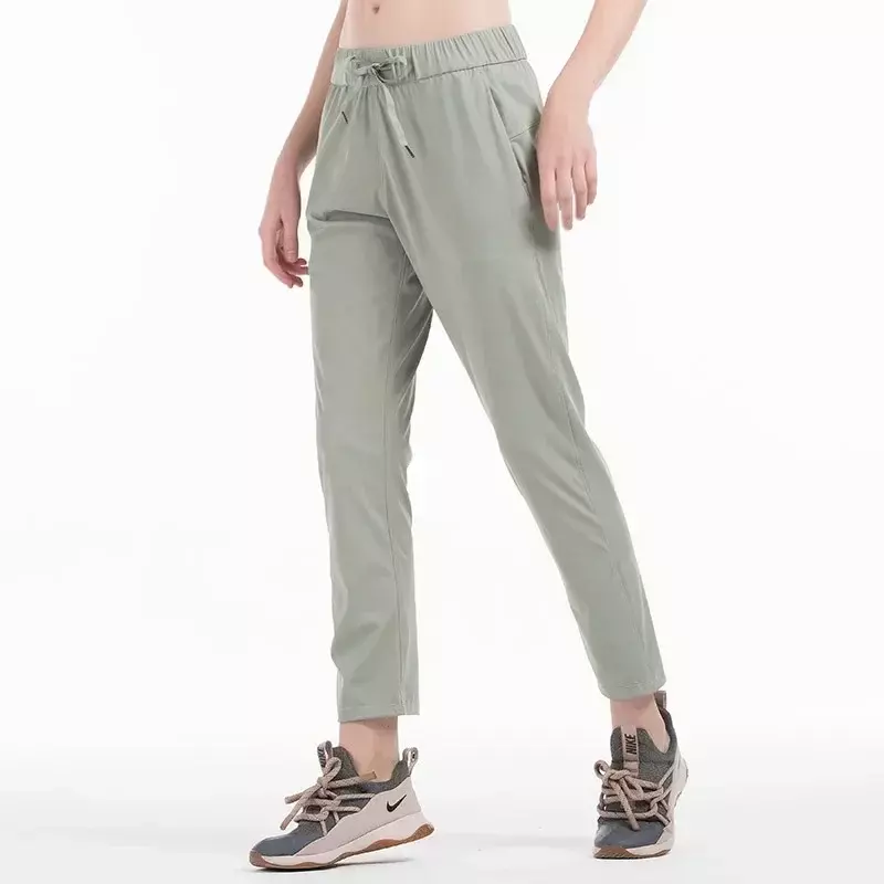 Lulu-Calças de ioga com bolsos laterais para mulheres, leggings de tecido elástico 4 vias, calças justas esportivas de ginástica, treino ao ar livre, corrida, super qualidade