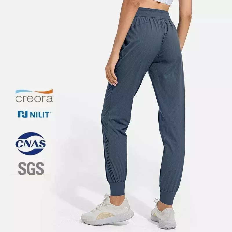Calça esportiva de cintura média para mulheres, tecido fino e respirável, ajuste solto, calças jogger de treino com bolsos, calças de ioga fitness