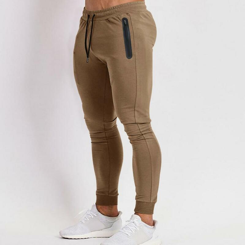 Celana panjang pria, celana olahraga sutra es dengan teknologi cepat kering desain Slim Fit kantong ritsleting samping untuk latihan Gym
