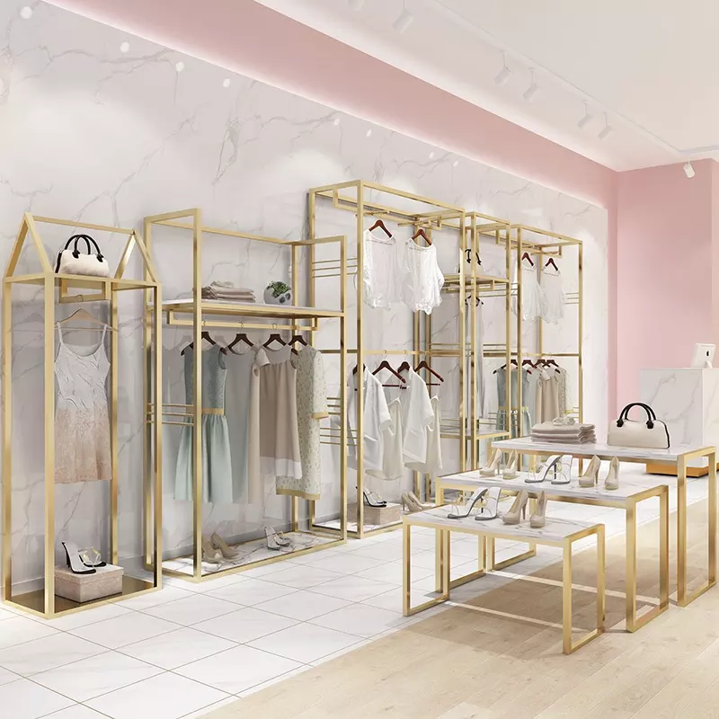 Niestandardowe, luksusowe butikowe złota ściana stojak na ubrania do gniazdowania obrusy stojak na półki stojak na ubrania sklep odzieżowy Fu