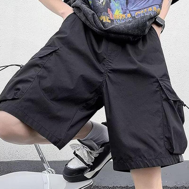 Calções de carga de cintura média masculina, elástico na cintura, cordão ajustável, bolsos múltiplos, streetwear de perna larga