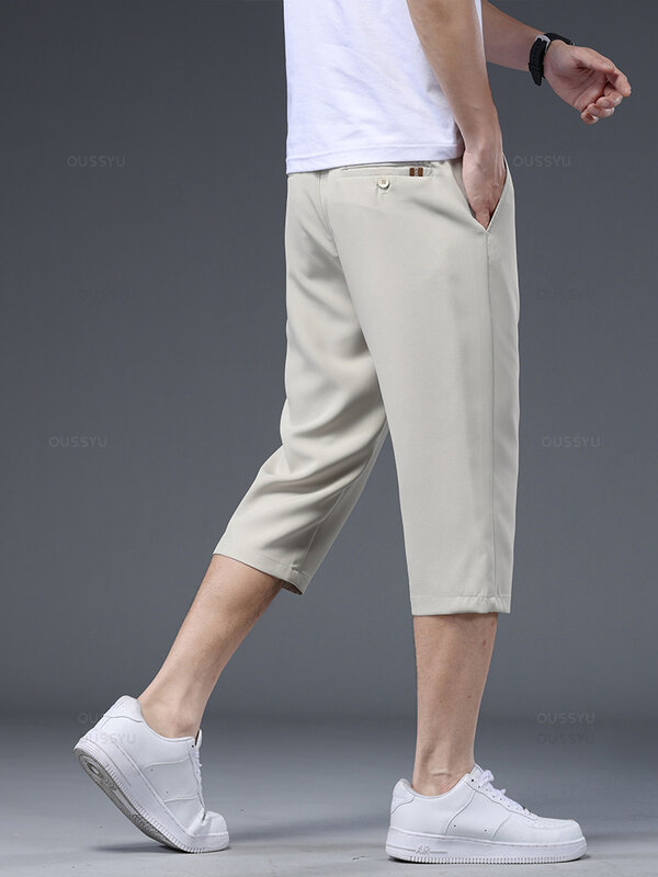 Pakaian bermerek setelan bisnis kualitas tinggi celana panjang betis pria pendulum warna polos halus celana pendek Formal kantor pria