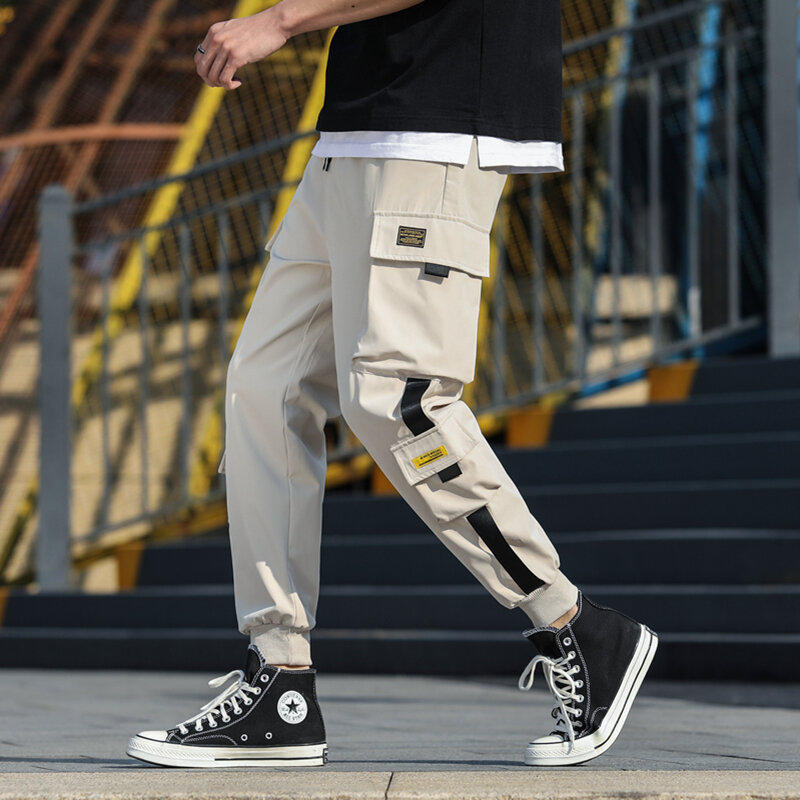 Moda uliczna męska Hip-hopowa spodnie do joggingu wstążki luźna moda spodnie Cargo męska nowa spodnie haremowe dla biegacza rekreacyjnego