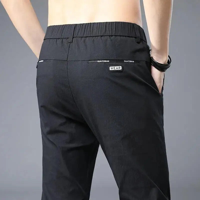 Pantalones informales coreanos de cintura media para hombre, pantalones empalmados con bolsillos, simplicidad de oficina, Verano