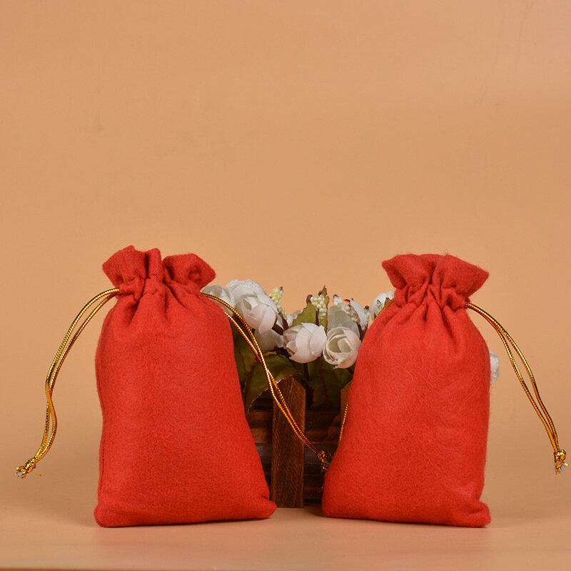 50 unids/lote 10x15 cm tela de fieltro rojo bolsa con cordón regalo de Halloween auricular juguete joyería embalaje bolsas de exhibición al por mayor