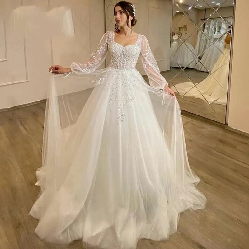 Wdzięczne kobiety celebrytki suknie ślubne tiulowe suknie ślubne o linii A puszyste długie rękawy o długości do mopowania księżniczki Vestidos De Novia