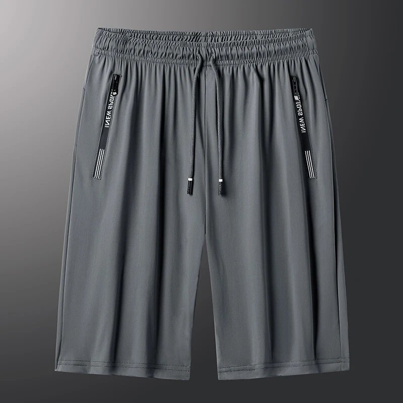 Minimalistyczny nowy w stylu Casual, letnia męski jednolity kolor elastyczne kieszonkowe sportowe spodnie klimatyzacyjne luźne spodenki