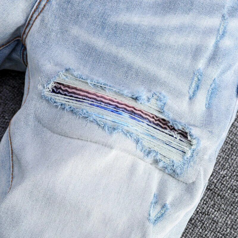 Modne dżinsy męskie uliczna wysokiej jakości światło Retro niebieski elastyczny chudy krój porwane jeansy mężczyzn łatany projektant Hip Hop markowe spodnie
