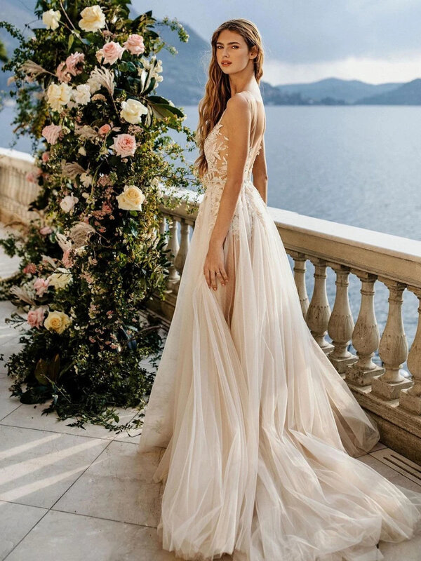 Artystyczna plażowa suknia ślubna bez rękawów bez pleców vestidos de novia seksowne przezroczyste aplikacje z okrągłym dekoltem suknie ślubne Boho koronki