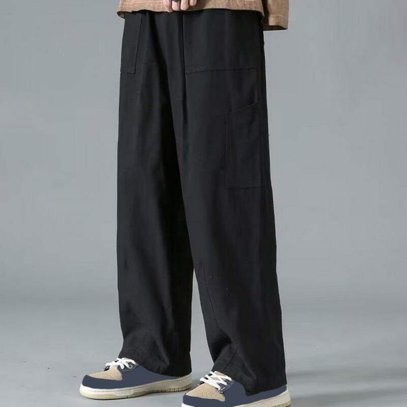 Baju kodok pria gaya Jepang longgar kaki lebar warna Solid pinggang elastis multi-saku panjang penuh pakaian jalan celana Harian