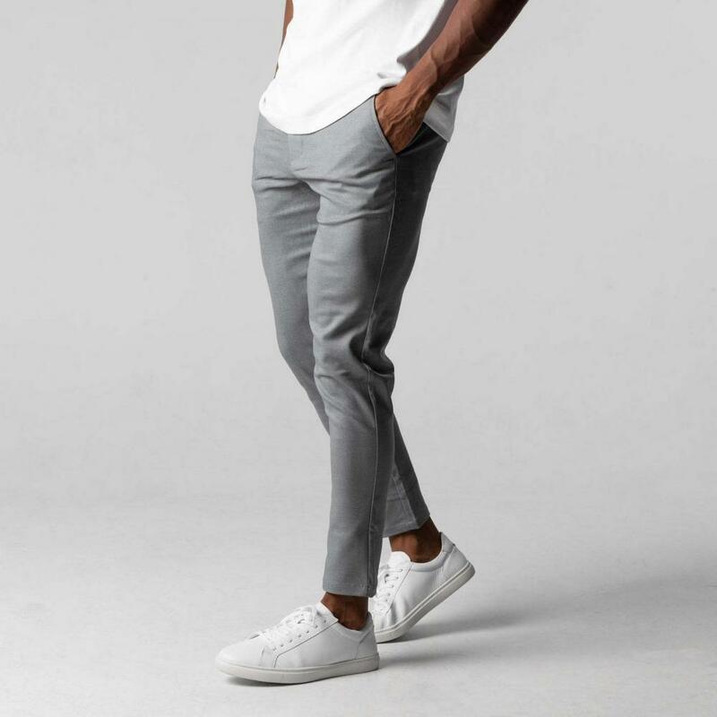 Celana panjang bisnis pria, kasual elegan Slim Fit dengan pinggang elastis kancing penutup kantong warna Solid untuk kenyamanan