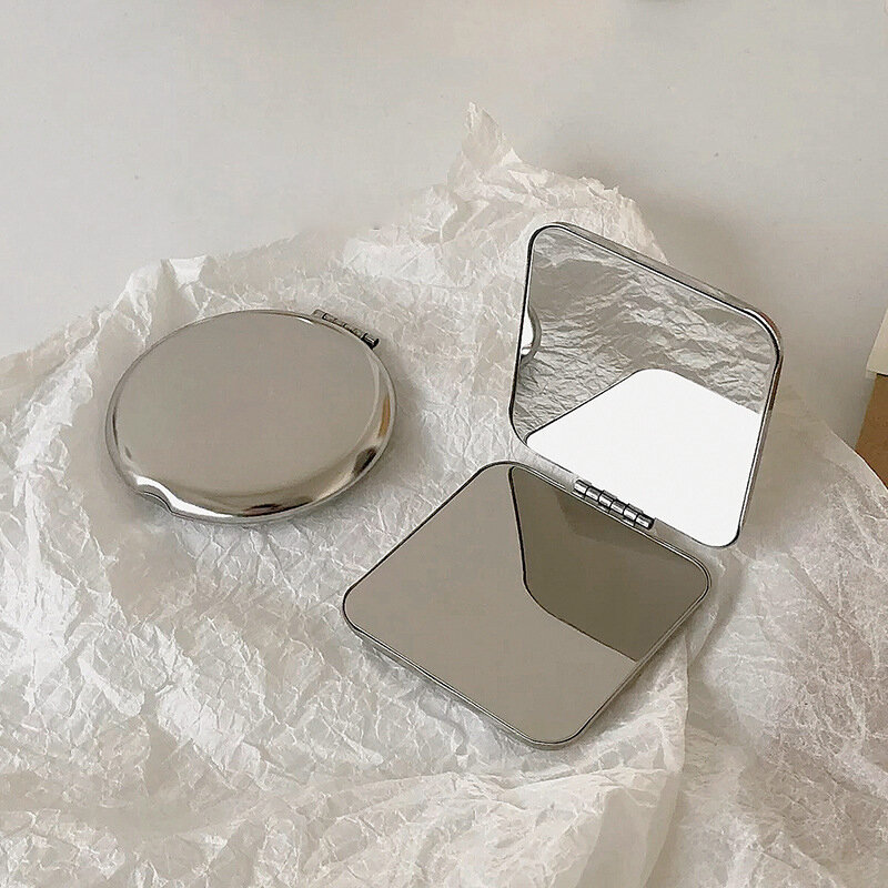 Espejo de maquillaje portátil de acero inoxidable para mujer, herramientas cosméticas de bolsillo de mano, espejo pequeño de varias formas