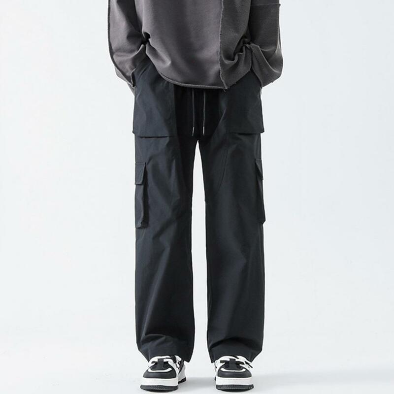 Calça masculina de cordão elástico com bolsos, calça de perna reta, estilo streetwear, macacão monocromático