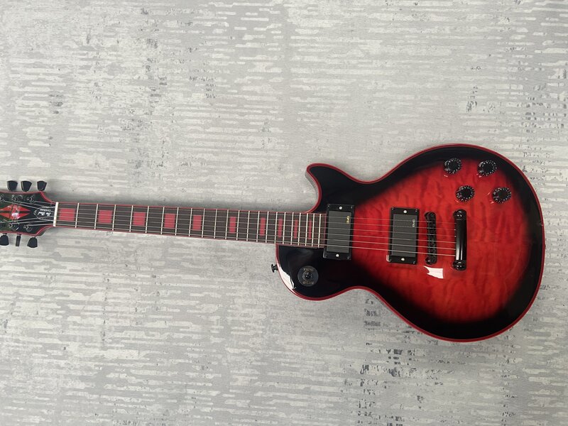 Gitar listrik, memiliki Gib $ on logo, besar pola veneer merah, logo merah mosaik merah, dibuat di Cina .. Bodi mahoni, gratis ongkos kirim