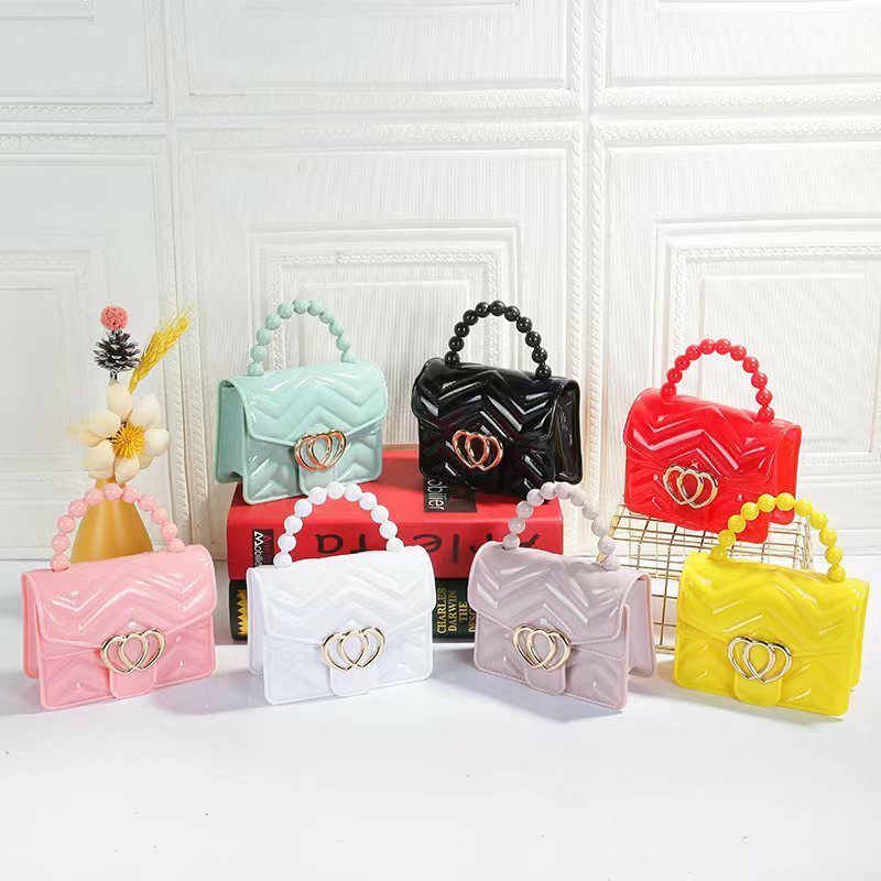 Kids Mini Candy Color Pearl Chain Handle Messenger Bag donna PU Leather Elegant Love Heart Small Shoulder Crossbody Handbag Gift