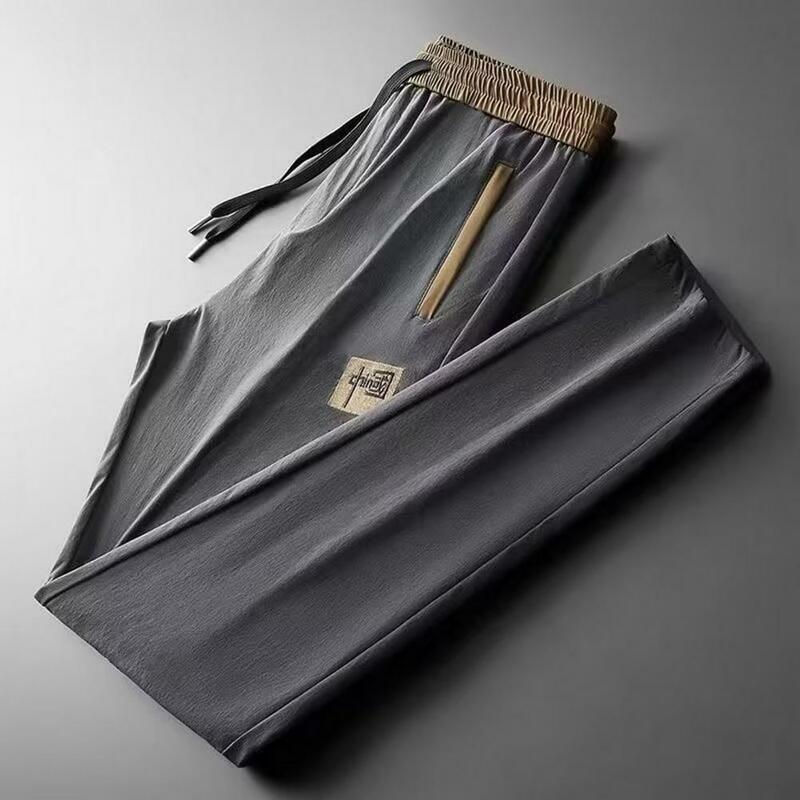 Jednokolorowe spodnie ze sznurkiem męskie elastyczne spodnie Cargo ze sznurkiem i boczne kieszenie letnie spodnie dresowe z prostymi nogawkami na zewnątrz