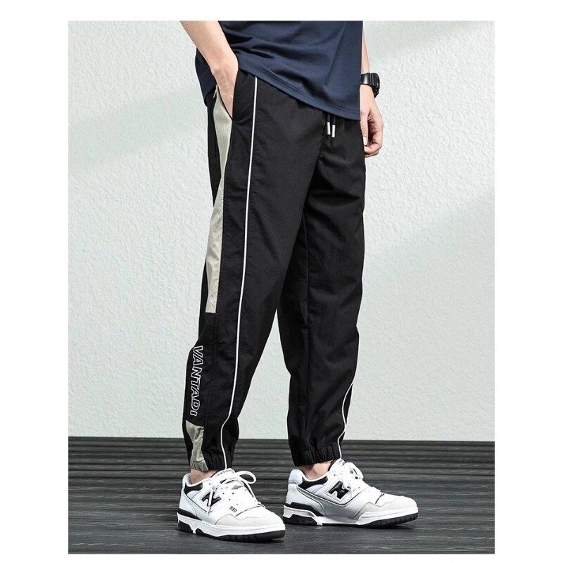 Летние мужские 2024 Новые лоскутные высокие эластичные модные однотонные свободные универсальные повседневные брюки с карманами